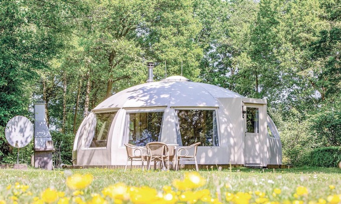 Municipality of Alphen-Chaam House | These detached bungalows with domed roofs are scattered in a wooded resort.