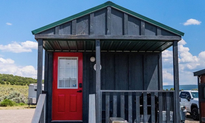 Meeker House | Tiny Home with one Queen bed and a Futon couch. Sleeps: 3