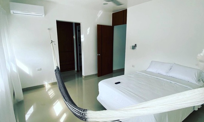 Tizimin House | Tizimín retreat: stylish townhouses, natural harmony, modern comforts.