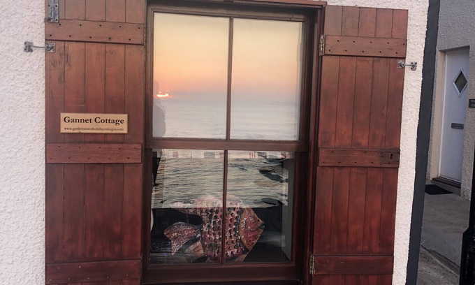 Gardenstown Cottage | Traditional Fisherman's Cottage directly on the sea wall.