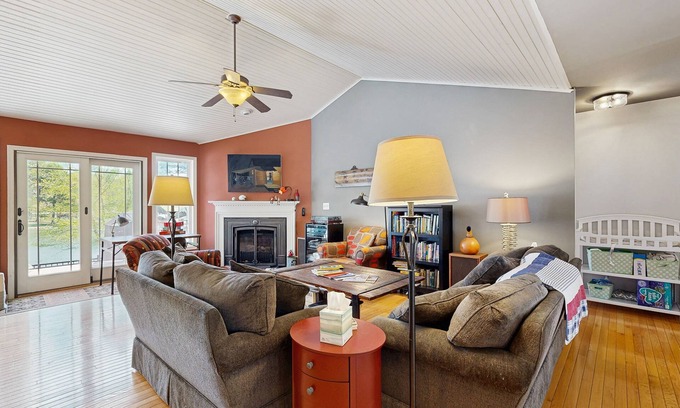 Bumpass House | Tranquil lakefront retreat with hot tub, screened porch, kayaks, and more