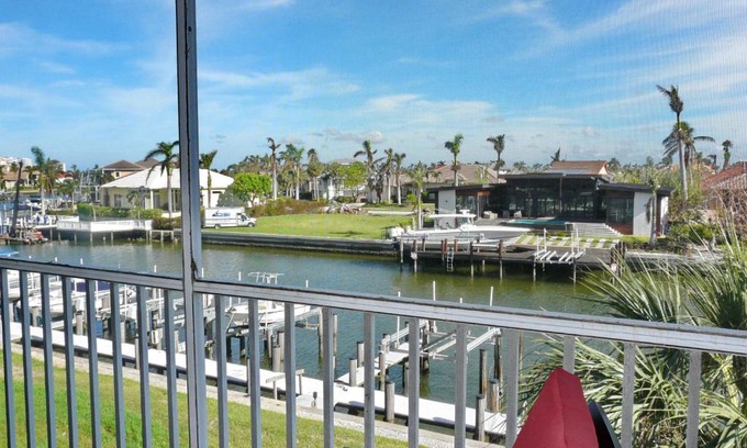 Marco Island Apartment | Tranquil waterfront condo with pool and steps to beach