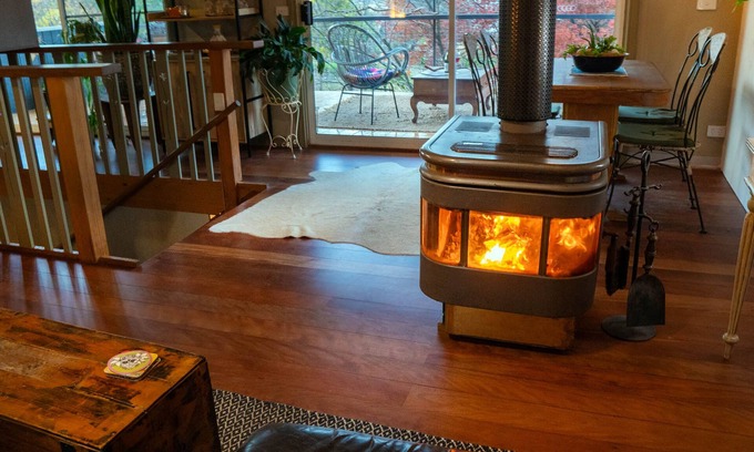 Tawonga South Apartment | Tree Tops Apt @ Dreamers features log fire, mountain + pool views thru tree tops