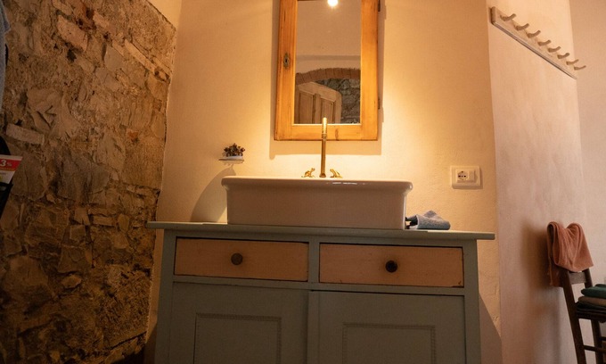 Gavorrano House | Tuscan barn with terrace + large living-dining area