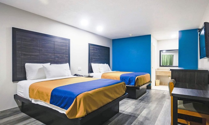 Wharton Hotel | Two Queen Beds Kitchenette Non-Smoking Room at Scottish Inns and Suites!