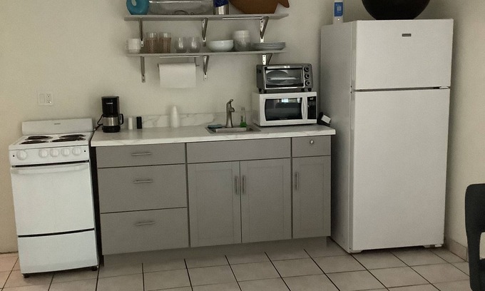 New Town Cottage | Uptown quiet cottage close to beaches, restaurant & shopping.