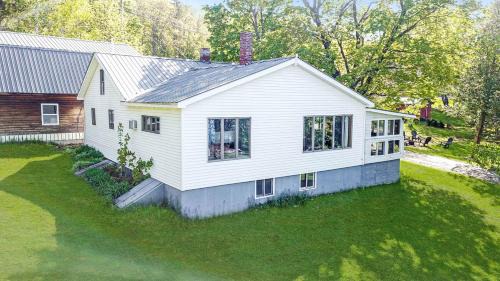 Portage Lake House | Embrace Nature in this Breathtaking Cottage in Portage Lake, Maine