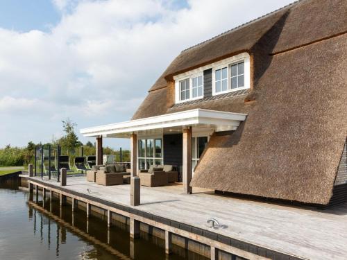 Delfstrahuizen Villa | Villa by the Water with Sauna and Terrace