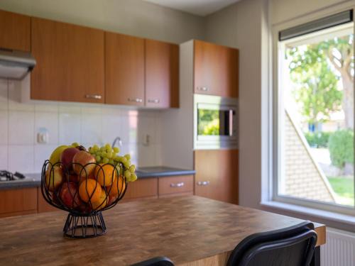 Andijk House | Villa in Friesland with Garden by Water