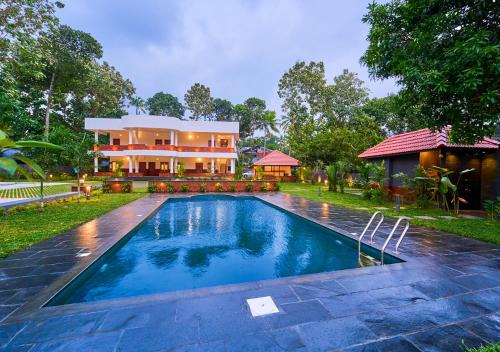 Varkala Hotel | VOYE HOMES Signature Pool Resort Varkala , Just 950 m from Varkala Cliff and Beach