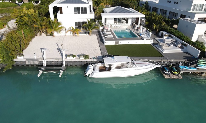 Leeward Settlement House | Waterfront Luxury Villa with Optional Boat and Beach Access Just Steps Away