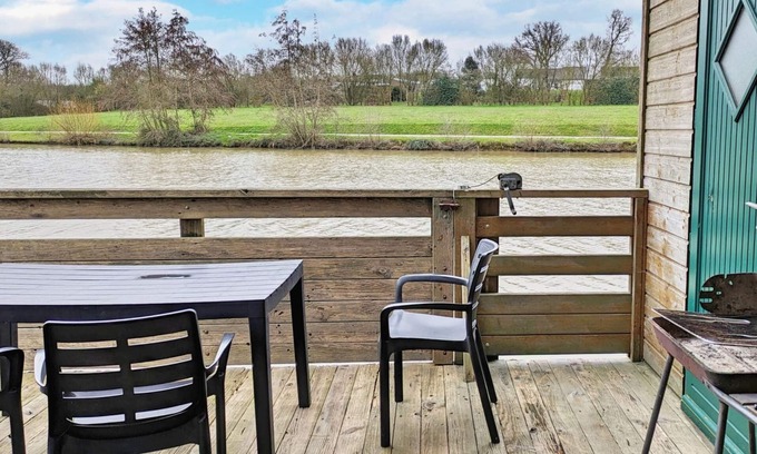 Villiers-Charlemagne Cottage | Waterfront Chalet with Private Fishing, Terrace, and Games, Sleeps 5-7