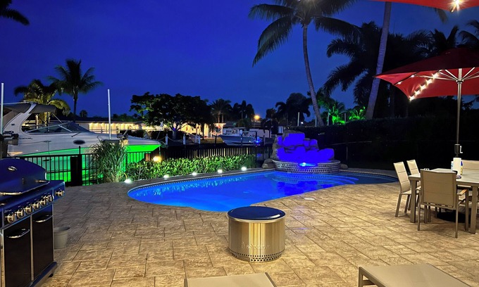Garden Isles House | Waterfront home with private backyard. Heated pool with waterfall Jacuzzi