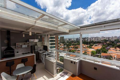 Campo Belo Apartment | Wehome -Duplex: barbecue and city view
