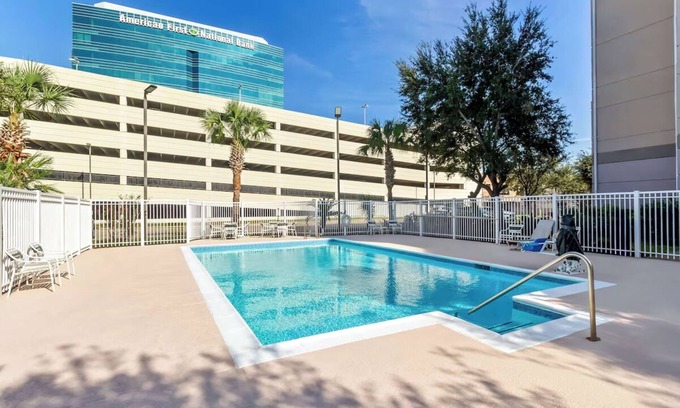 Chinatown Hotel | Westchase Escape with Breakfast, Outdoor Pool, and Quick Drive to CityCentre