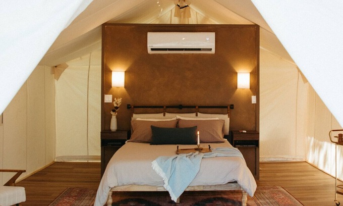 Prairie Lea RV Rental | Wooded retreat space with glamping tents, container homes & tons of amenities!