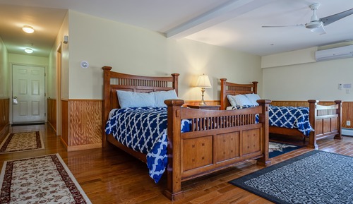 Room 2: Two Queen beds, private bath.
