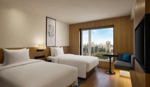Twin Room with Two Twin Beds, Sofa Bed, and Skyline View