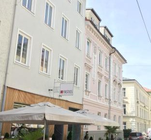 Three-Bedroom Apartment with Balcony and City View