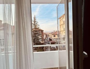 One-Bedroom Apartment with Balcony and City View