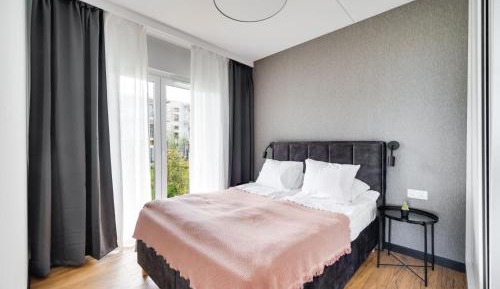 Two-Bedroom Apartment with Private Garden and Sea View