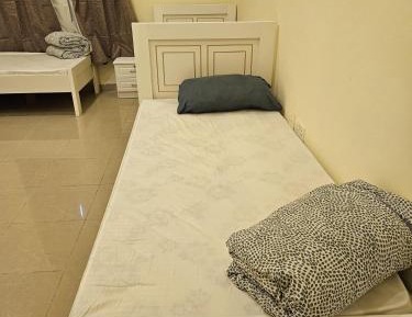 Single Bed in Dormitory Room