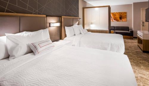 Suite with Two Queen Beds and a sofa