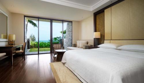 Sheraton Travels   - Garden View Room (Need to make appointment 3 days in advance: 1 time afternoon tea + Sanya Airport pick-up and drop-off service+ Children(4-16 years) surfing experience in T shape swimming pool + Audits paddle board in T shape swimm