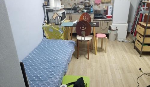 Single Bed in Dormitory Room