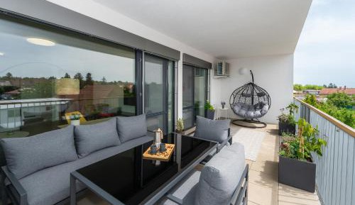 One-Bedroom Apartment with Balcony and City View