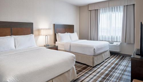 One-Bedroom Queen Suite with Two Queen Beds and Sofa Bed - Full Size Kitchenette