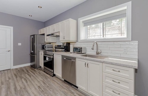 Pickering House | Lower flat with full access to lower patio and backyard , close to the beach .