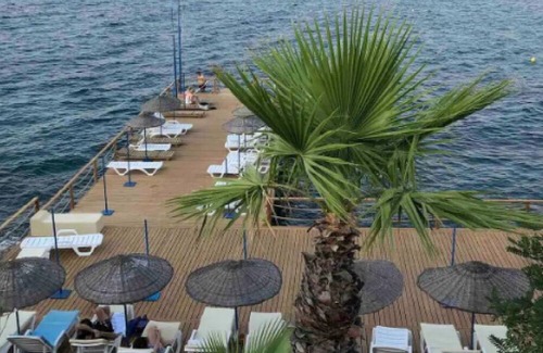 Gundogan Villa | In Gundogan, with private beach and social facilities an upfront seaside villa.