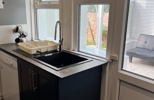 Westcliff-on-Sea Apartment | Mid-size bedroom with shared bathroom