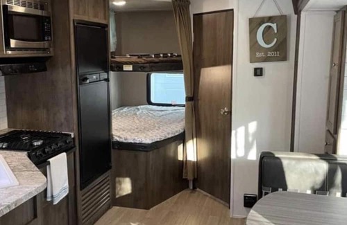 Aurora RV Rental | Camper located in campground! Walking distance to fishing!