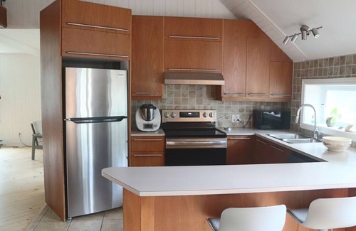 Saint-Etienne-De-Bolto Apartment | Beurrerie de St-Étienne, working and vacation residence in the heart of the village