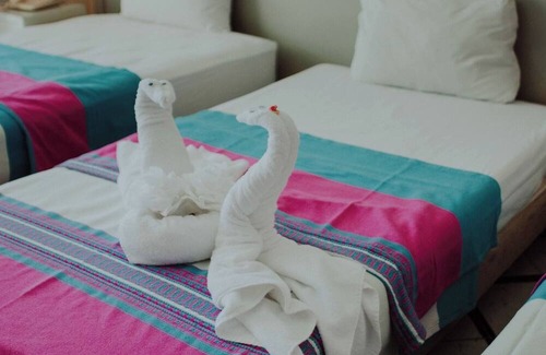 Merida Municipality Hotel | 2 Triple Rooms at Mérida, Perfect for Families & Poolside Relaxation