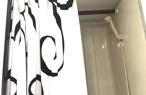 Milton RV Rental | KY Derby-themed glamper nestled in a beautiful treed area of the park. Sleeps 2-3, futon + drop-down table for 2nd bed. Staying here entitles our guests to access all of the park's amenities like the sparkling pool and spa with waterfall and cave gro