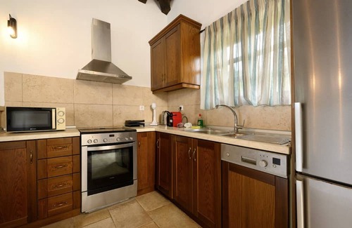 Kavvadades Villa | Dazzling Corfu Villa | Villa Emerald Horizon | 2 Bedrooms | Spacious Furnished Terrace with Shaded Outdoor Dining Area | Private Garden, Pool and Hot Tub | Prime Location | Arillas, Mega Lithari