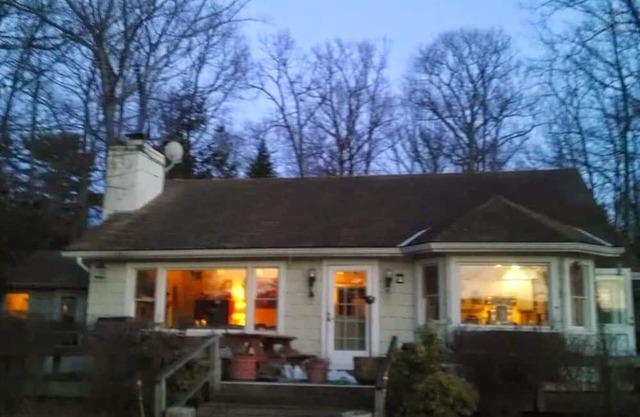 Glacial lake on top of mountain, boats, floating dock, fishing, swimming, beach.