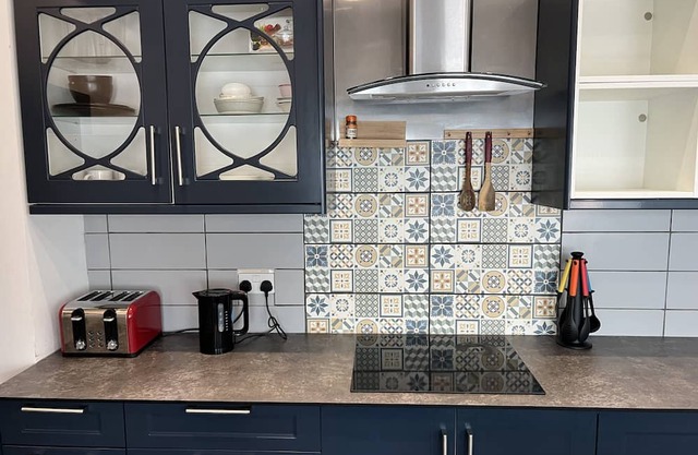 Mid-size bedroom with shared bathroom