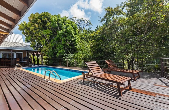 Tropical beachfront getaway with private pool, ocean views & enclosed yard