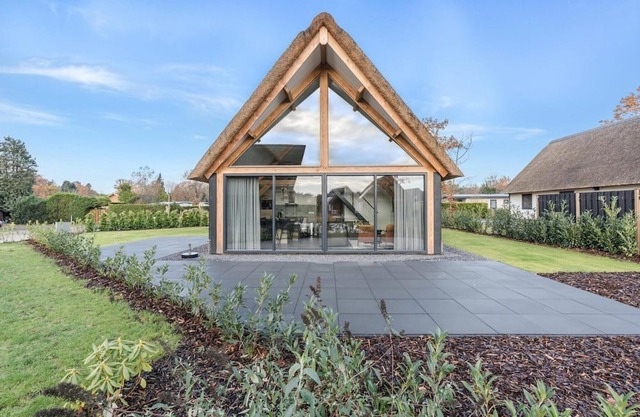 Modern bungalow in Baarle-Nassau with pond view