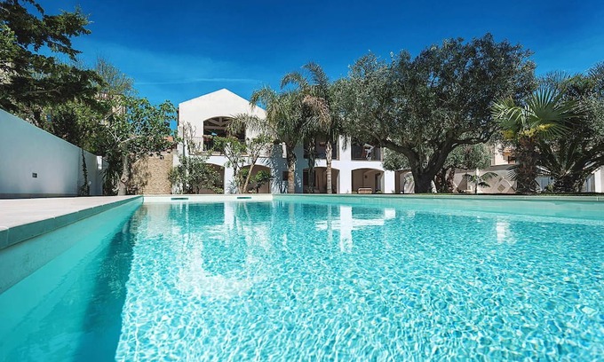 Marsala House | My Rental Homes - Casa Tika with shared pool surrounded by a wonderful garden