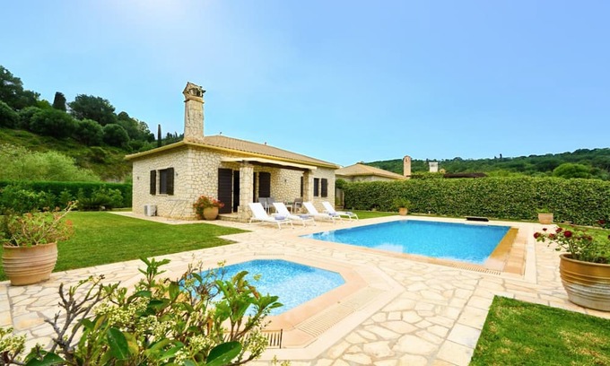 Kavvadades Villa | Dazzling Corfu Villa | Villa Emerald Horizon | 2 Bedrooms | Spacious Furnished Terrace with Shaded Outdoor Dining Area | Private Garden, Pool and Hot Tub | Prime Location | Arillas, Mega Lithari